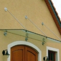 Edelstahl Glas Vordach abgehängt mit Punkthalter & Zugstreben als Pultdach Ausführung